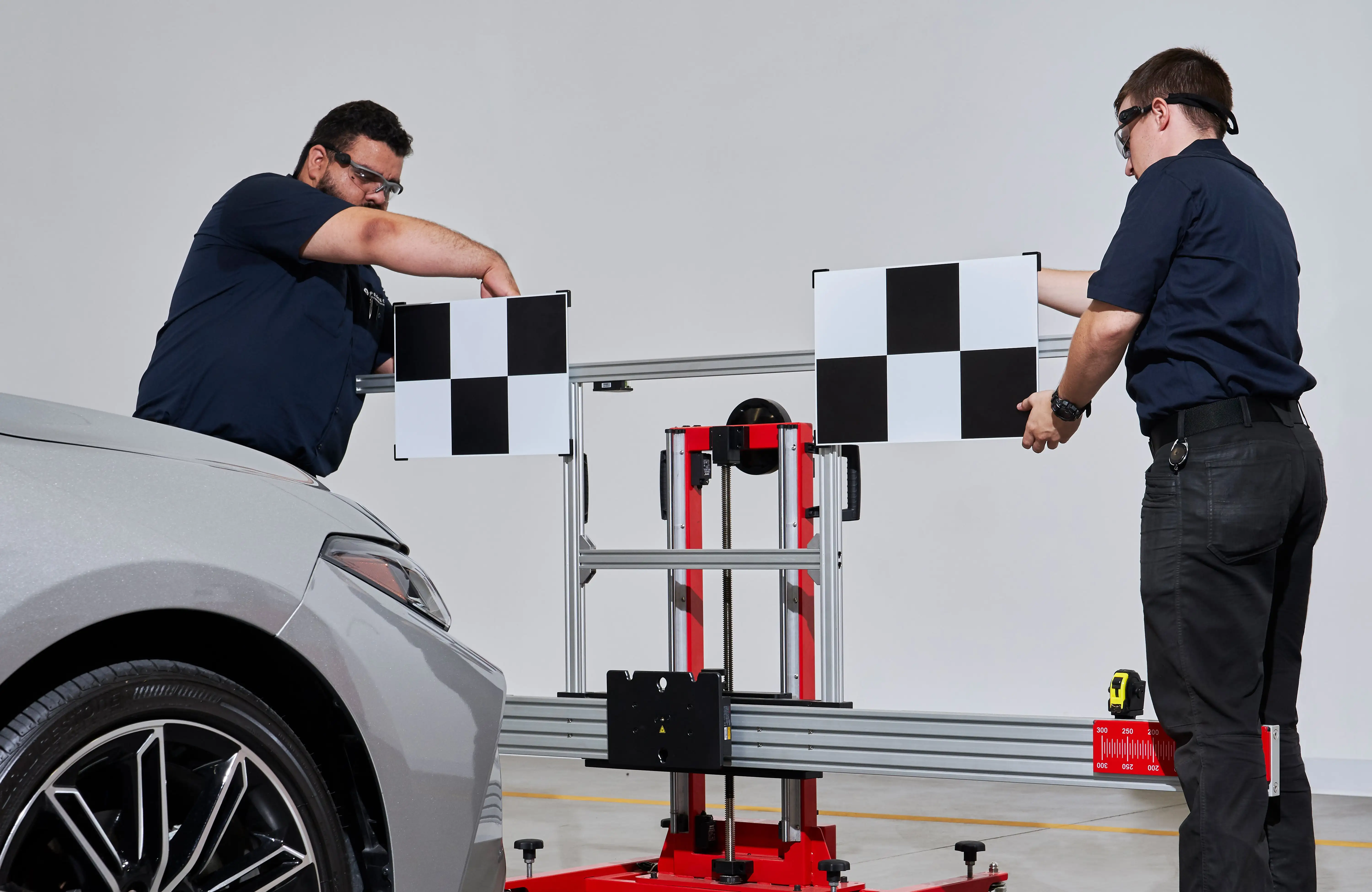 Expert technicians preparing for ADAS calibration